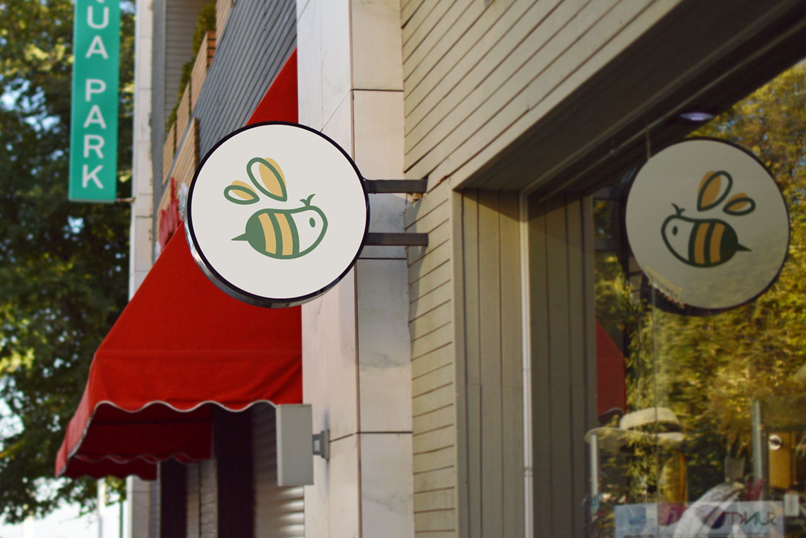 Circular window sign with Do, Be, Become bee symbol.